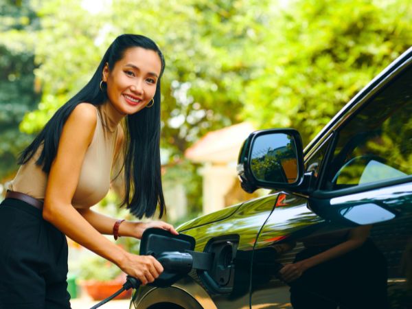 Woman with an Electric Car